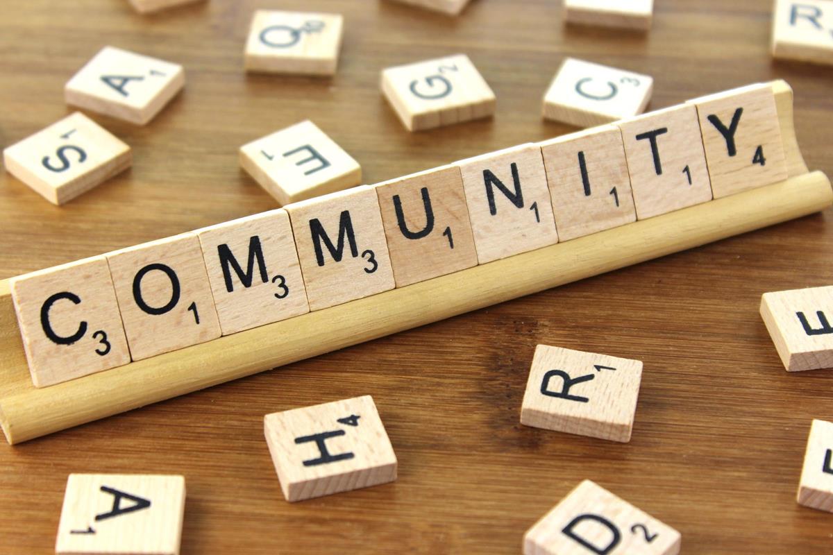 Scrabble pieces spelling Community